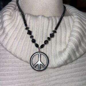 BLACK BEADED PEACE SIGN NECKLACE. CLASP SCREWS TOGETHER